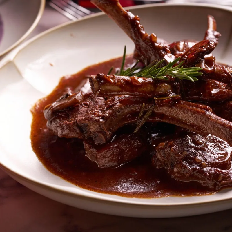 Braised lamb in red wine sauce — Lo D'Alex Miami