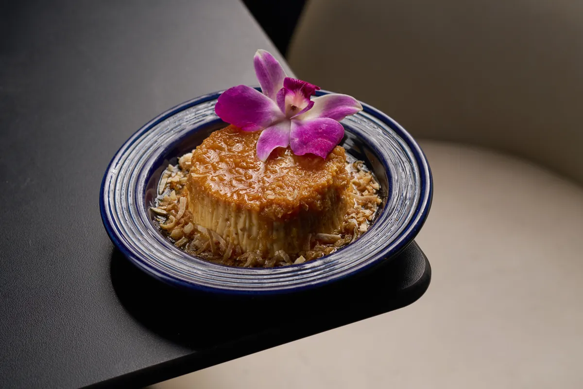 Traditional Cuban Flan — silky vanilla custard with caramel sauce — classic dessert at Lo D'Alex Restaurant Miami