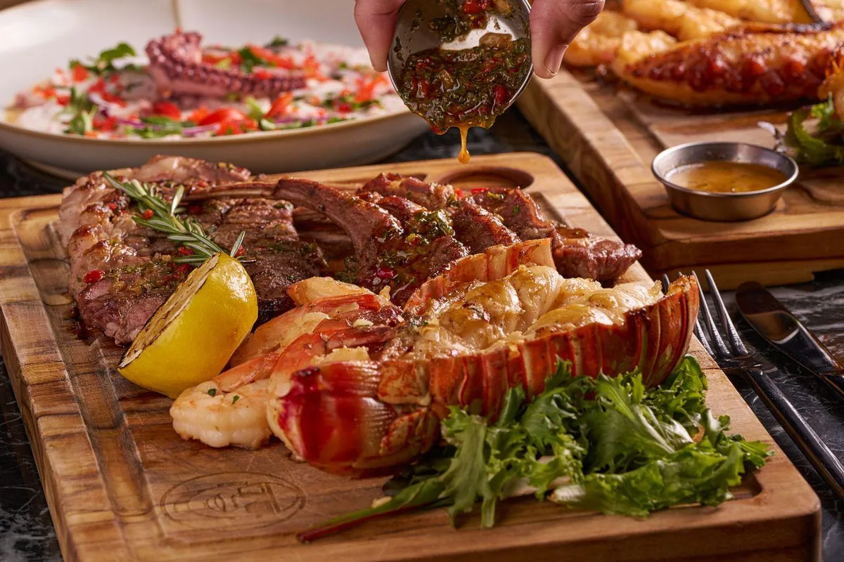 Lobster and steak with chimichurri at Lo D'Alex Miami