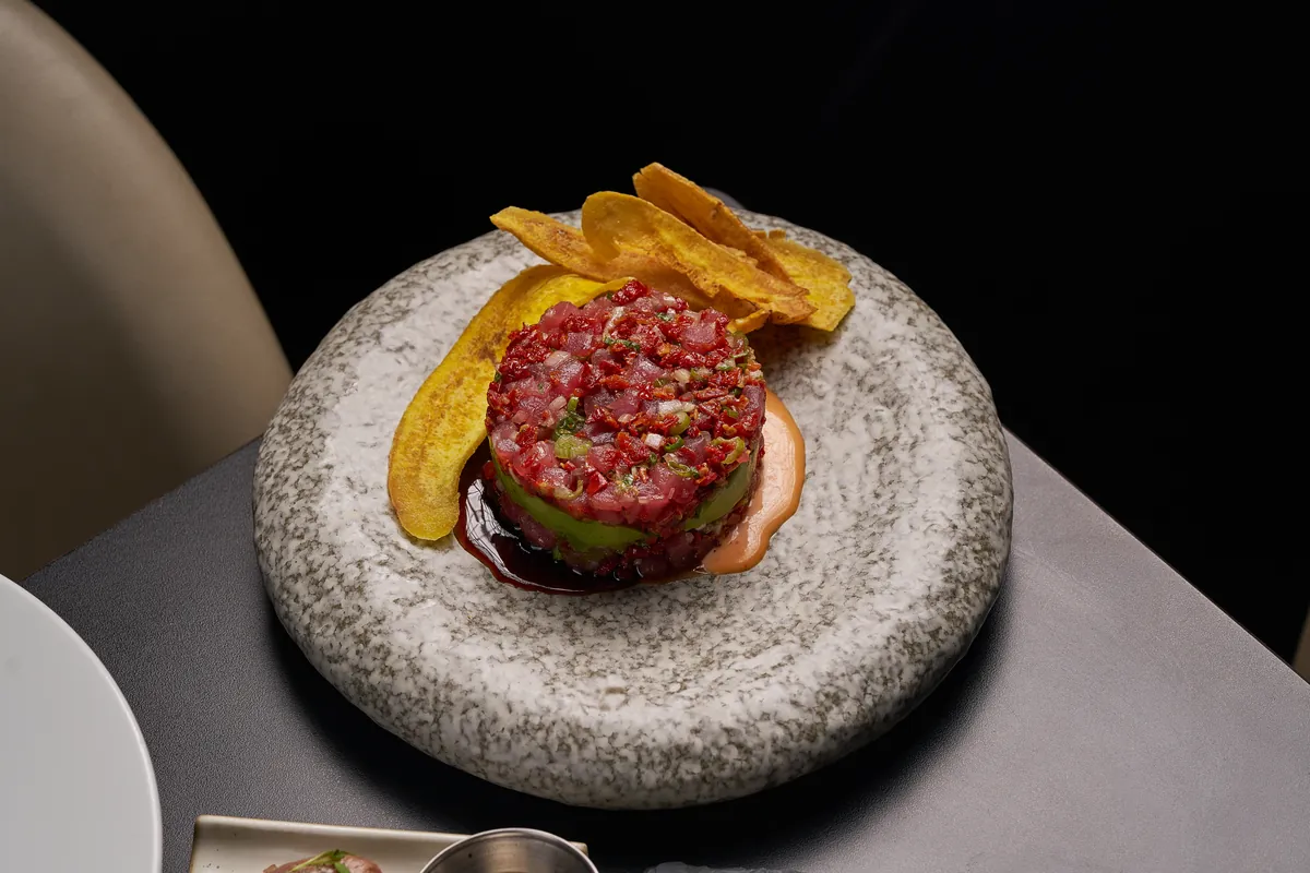 Fresh Salmon and Tuna Tartare with citrus soy dressing, avocado and crispy wontons — appetizer at Lo D'Alex Miami on Calle 8