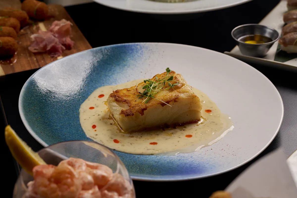 Grilled Chilean Seabass with vegetables and mashed potatoes — premium seafood at Lo D'Alex Restaurant Miami