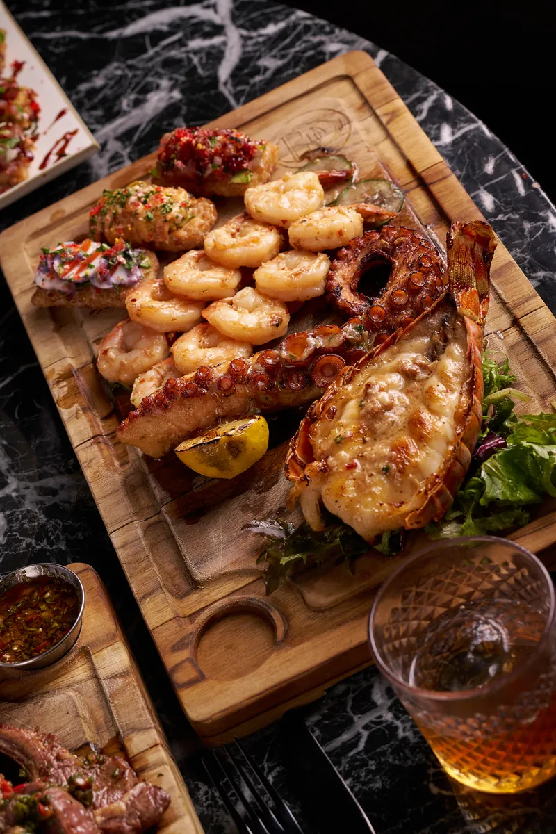 Tabla de Mariscos — grilled seafood sharing platter with lobster, shrimp and octopus at Lo D'Alex Miami