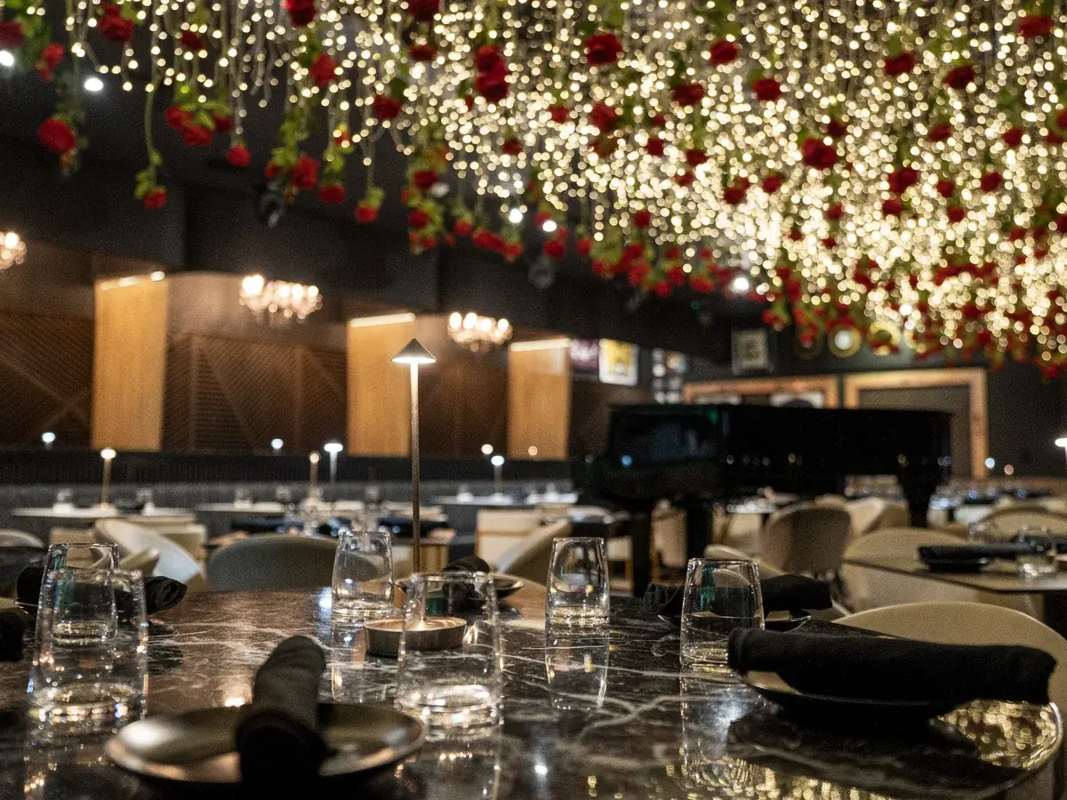 Lo D'Alex restaurant interior — red roses ceiling and elegant tables on Calle 8 Miami